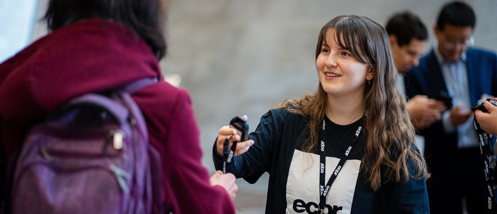 Ambassador scanning a participant's badge at an ECPR event